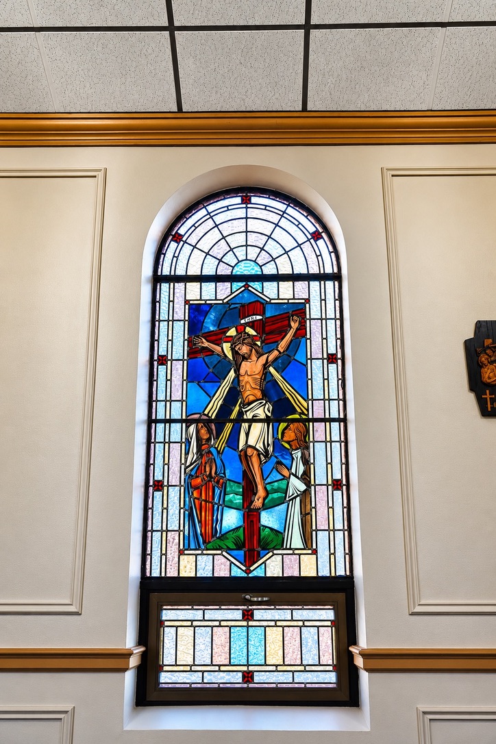 Stained-glass window depicting the Crucifixion of Jesus at Our Lady of Perpetual Help