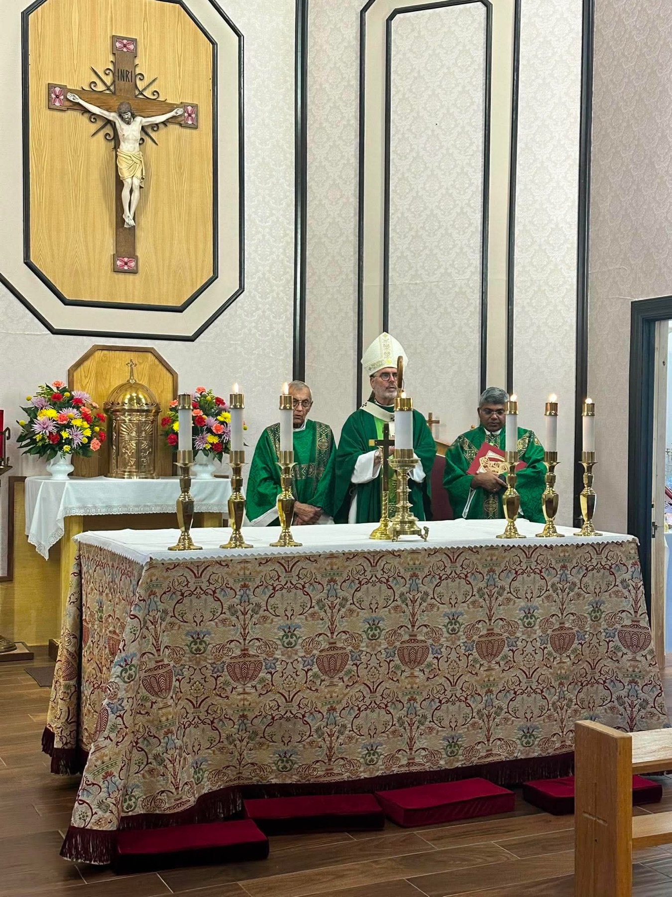 Archbishop Coakley celebrating Mass at the altar of St. Ann Catholic Church
